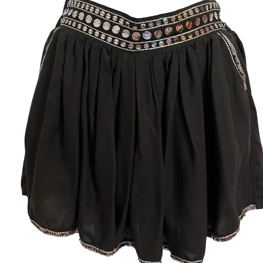 Justice black skort with silver sparkly trim along waistline and hem sz 12